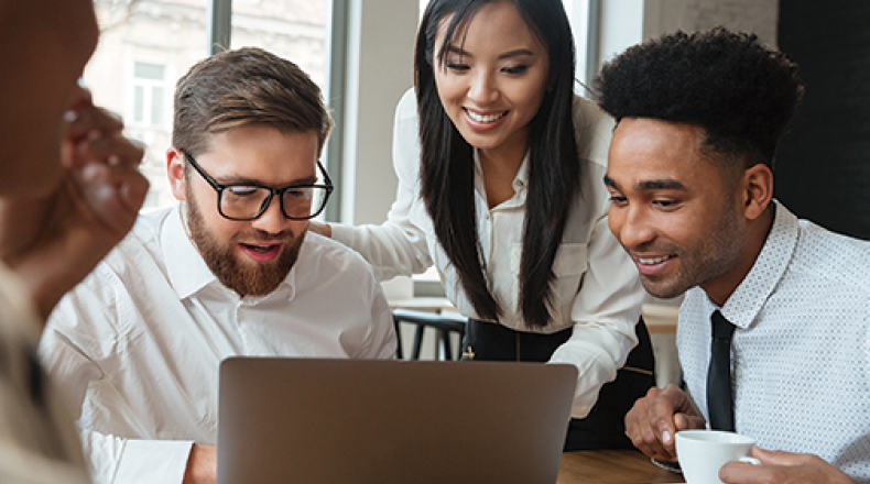 business professionals looking at a computer