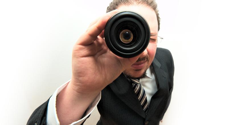 man in a suit with spyglass 