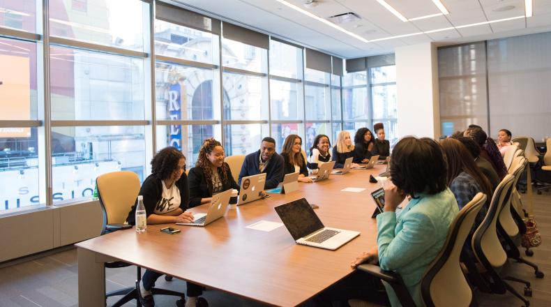 meeting of people in conference room