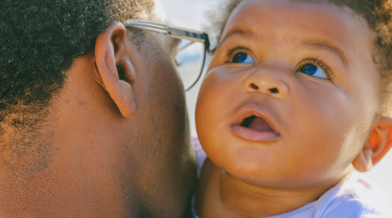 man holding baby