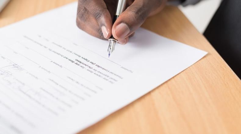 hand signing a document