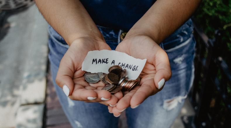 woman holding change