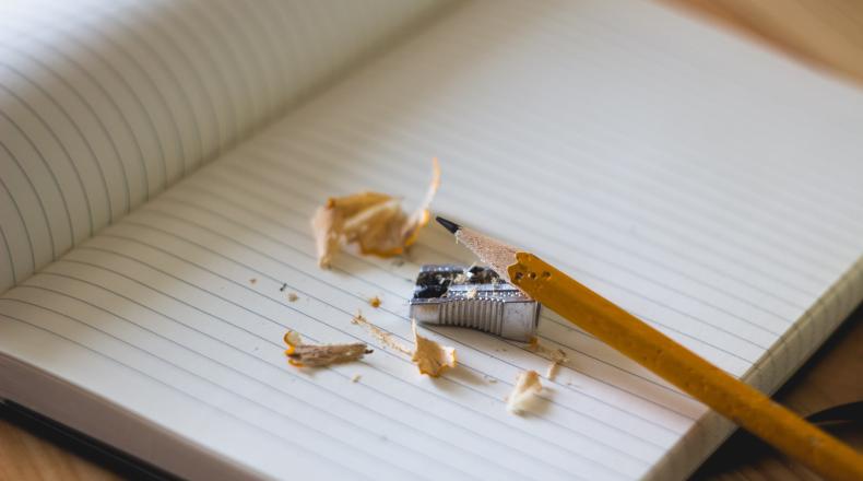 pencil and sharpener on notebook page