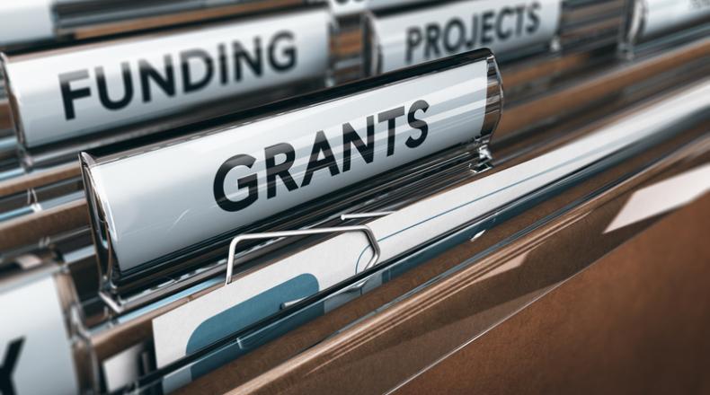 file folders showing words grants, projects and funding