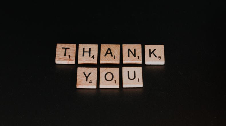 Thank you spelled out with letter tiles