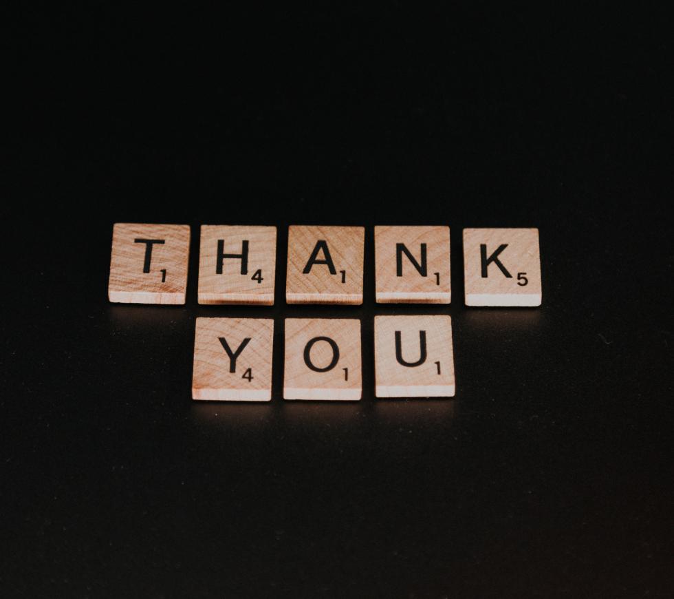 Thank you spelled out with letter tiles