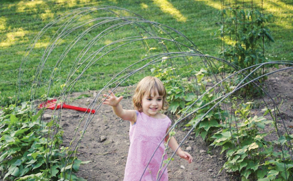 Child playing in a garden