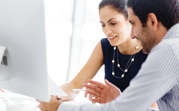 Man and woman looking at a document