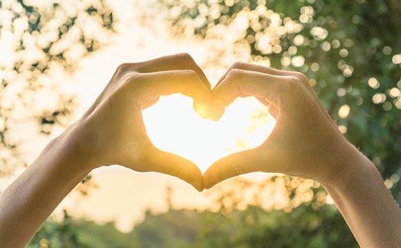 Hands forming the shape of a heart