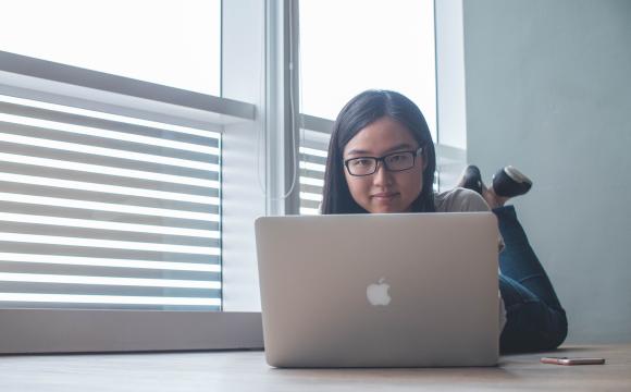 woman looking at laptop