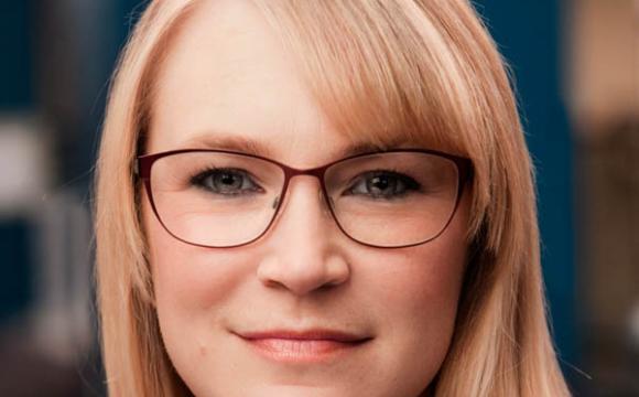 Pamela Witter Headshot wearing glasses and smiling