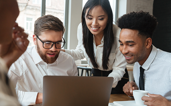 business professionals looking at a computer