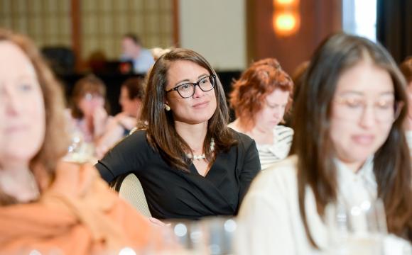 women listening to speaker