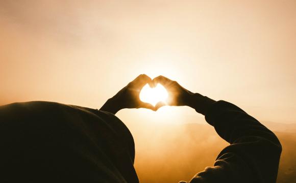 woman making heart with hands