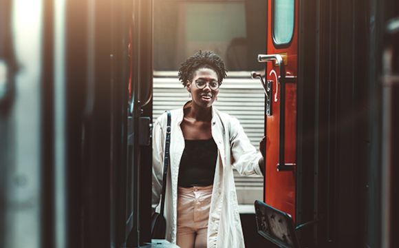 portrait of a beautiful young woman on a train