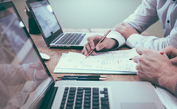 two men reviewing research