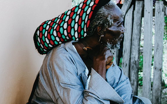 man from jamaica sitting and thinking