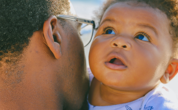 man holding baby