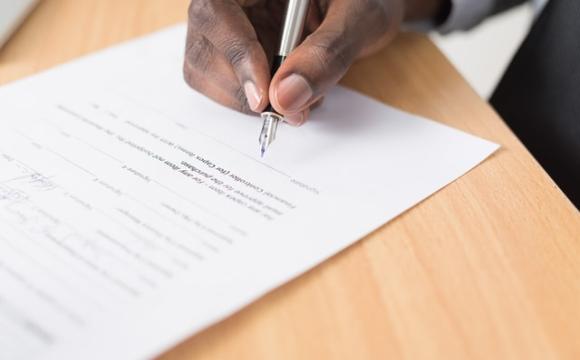 hand signing a document