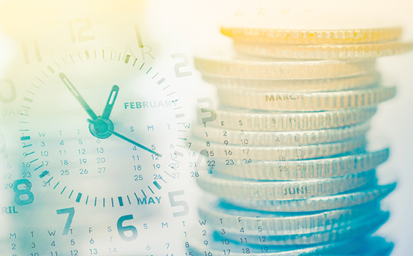 stack of coins with a clock