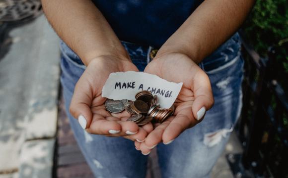 woman holding change