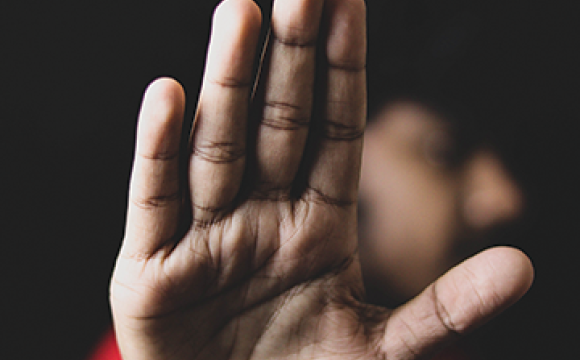 man holding out his hand in a stop motion