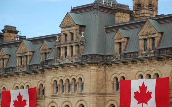 building displaying two Canadian flags