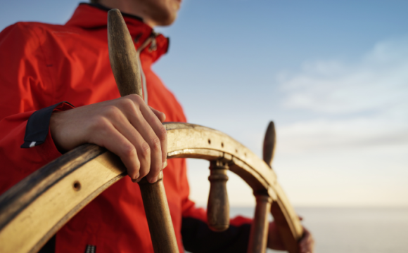 Person steering a ship